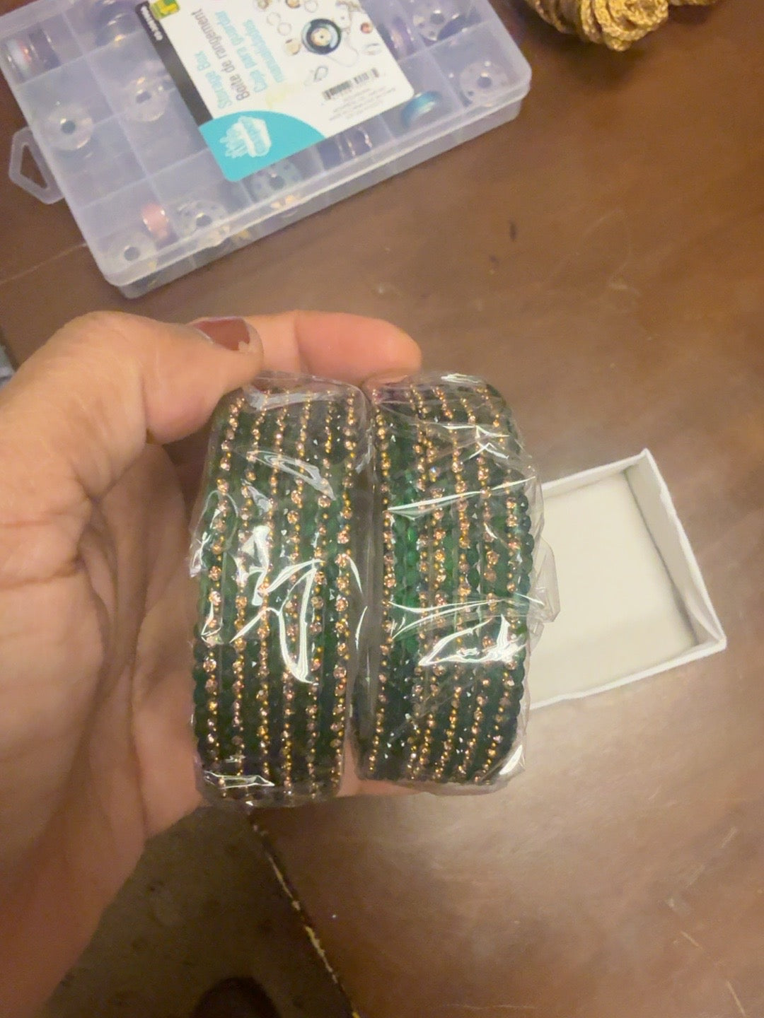 Green glass bangles with gold detailing
